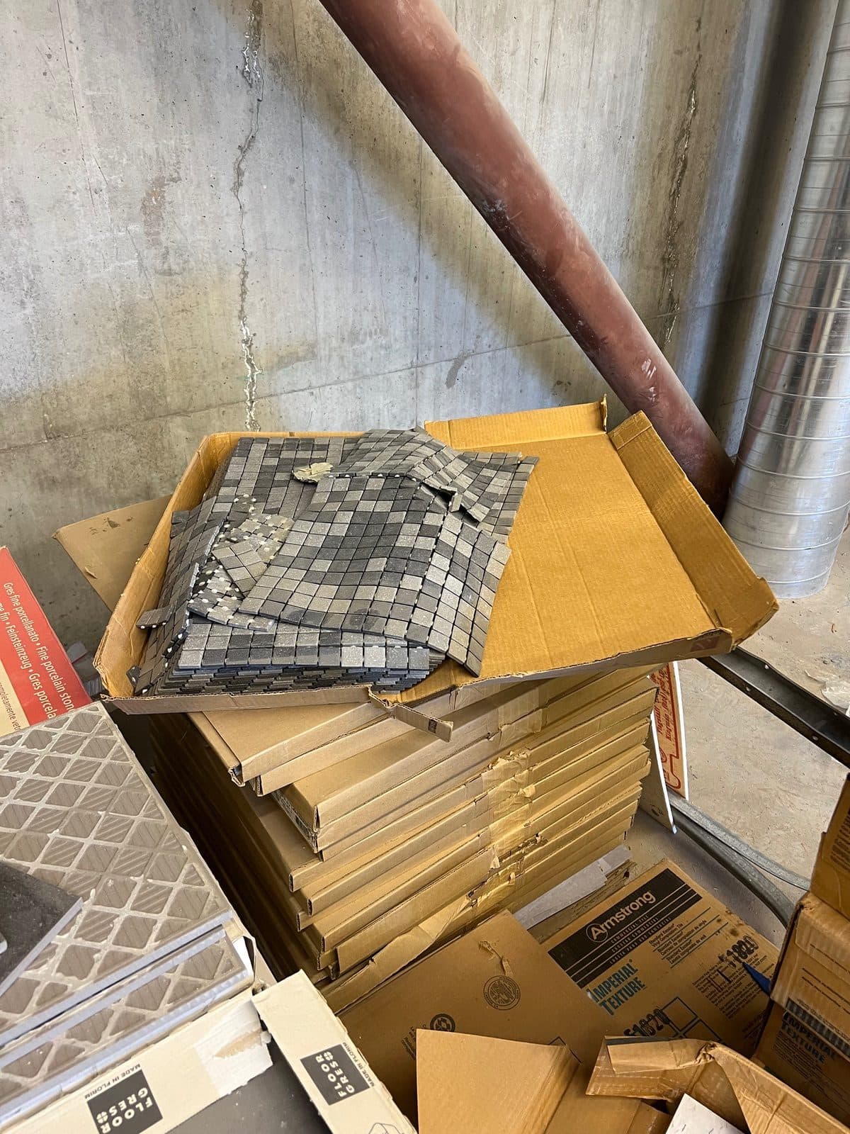 Boxes of unused Florim Italian Stone tile and backsplash. Light grey and dark grey in color. Looking for