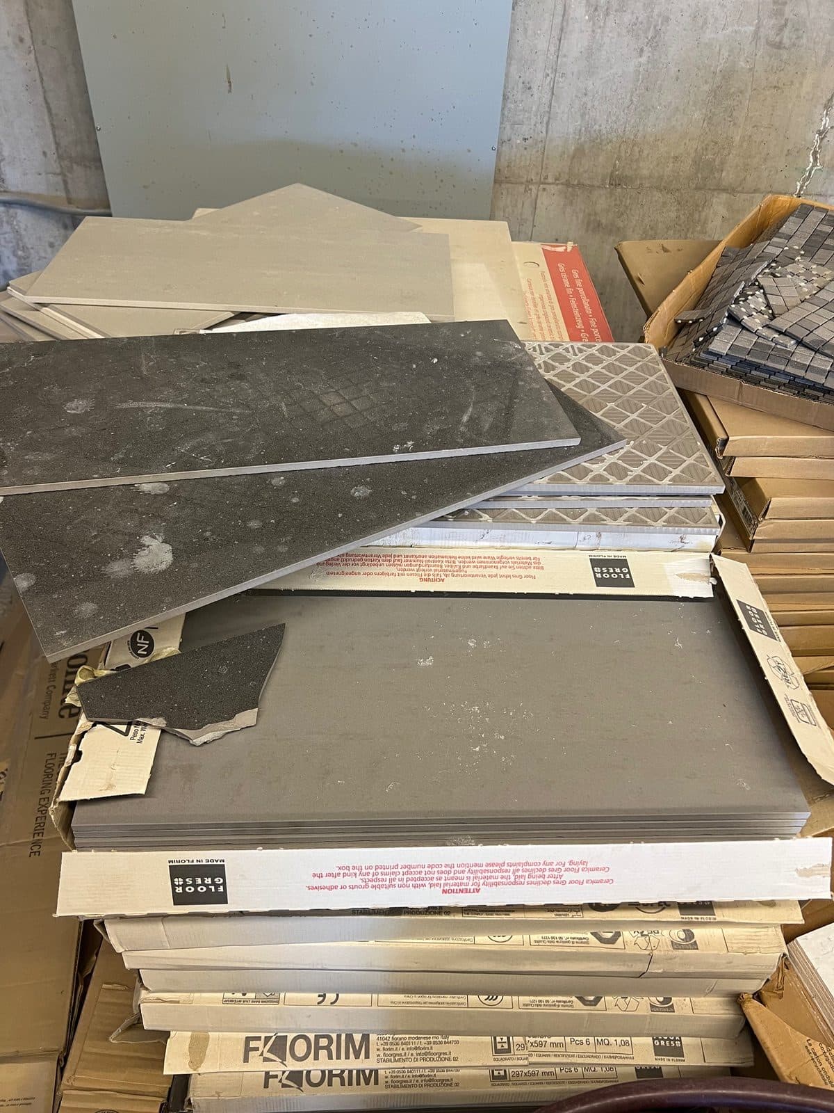 Boxes of unused Florim Italian Stone tile and backsplash. Light grey and dark grey in color. Looking for 2