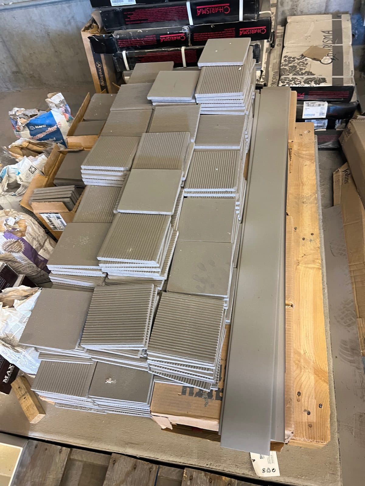 Boxes of unused Florim Italian Stone tile and backsplash. Light grey and dark grey in color. Looking for 3