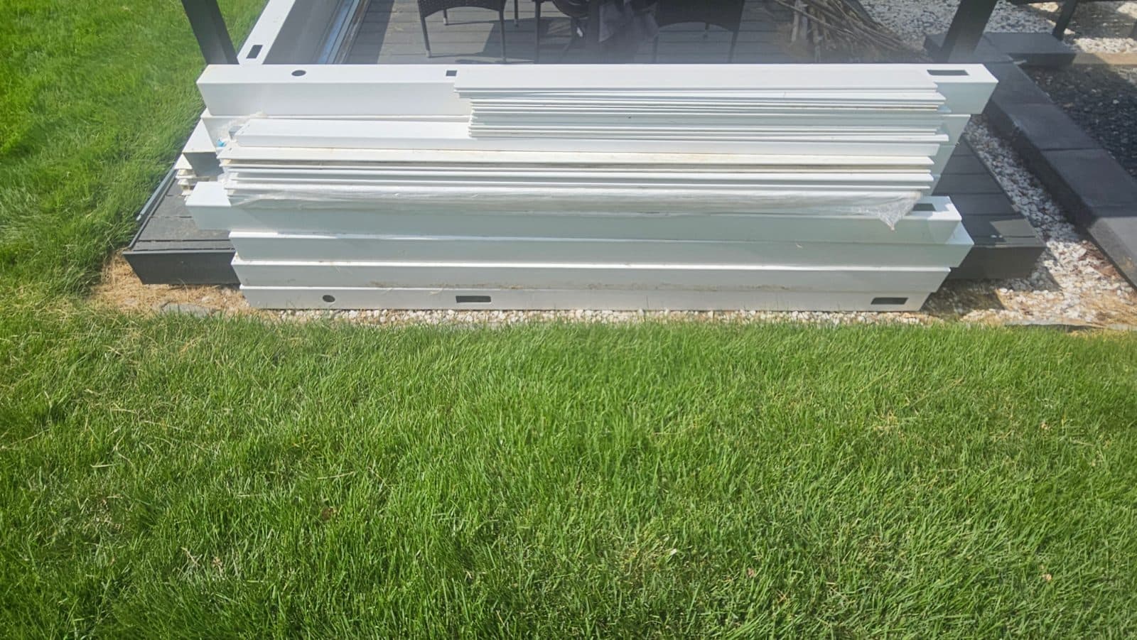 White Vinyl Fence Line Posts with Railings and Pickets