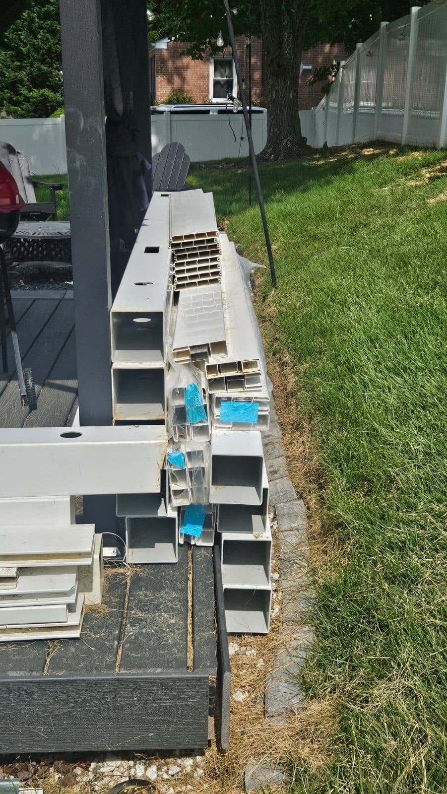 White Vinyl Fence Line Posts with Railings and Pickets 2