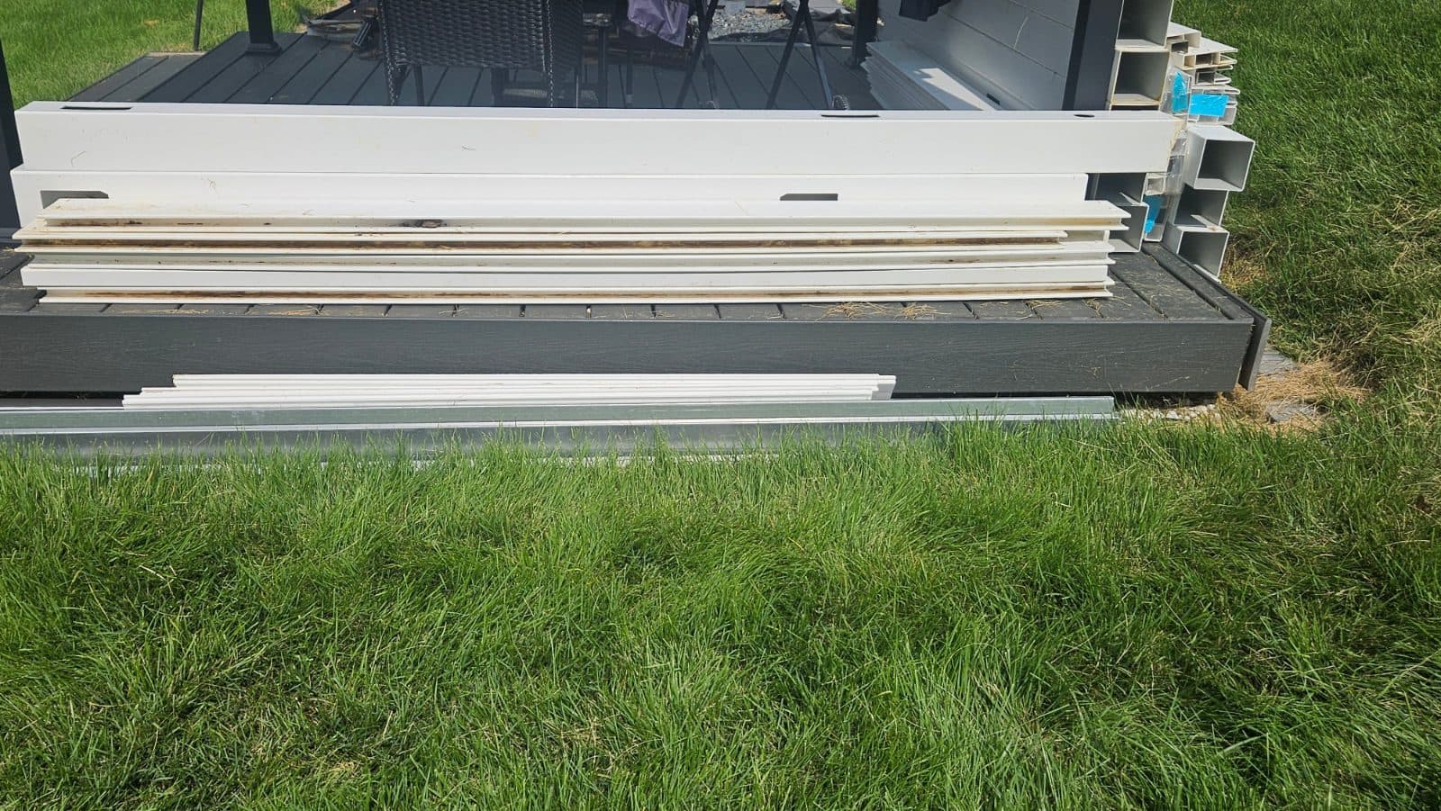 White Vinyl Fence Line Posts with Railings and Pickets 3