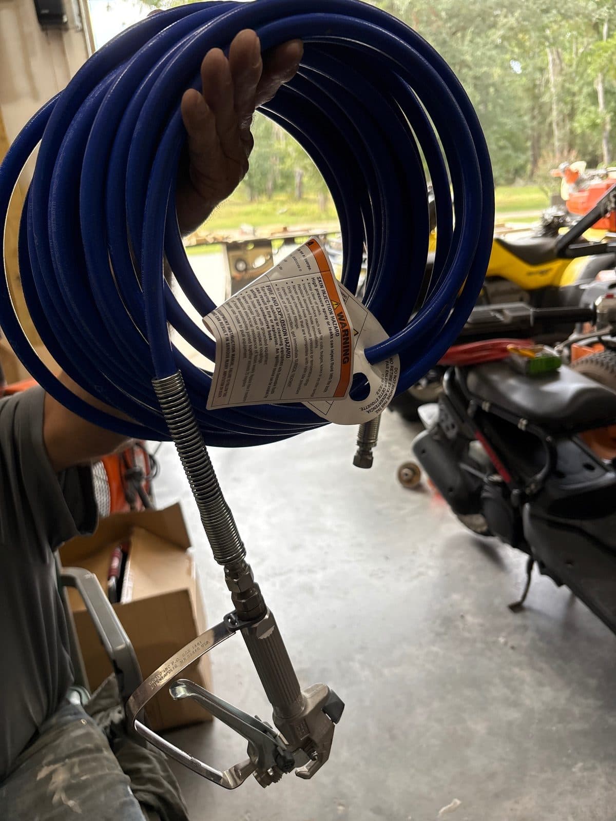 Paint sprayer with hose