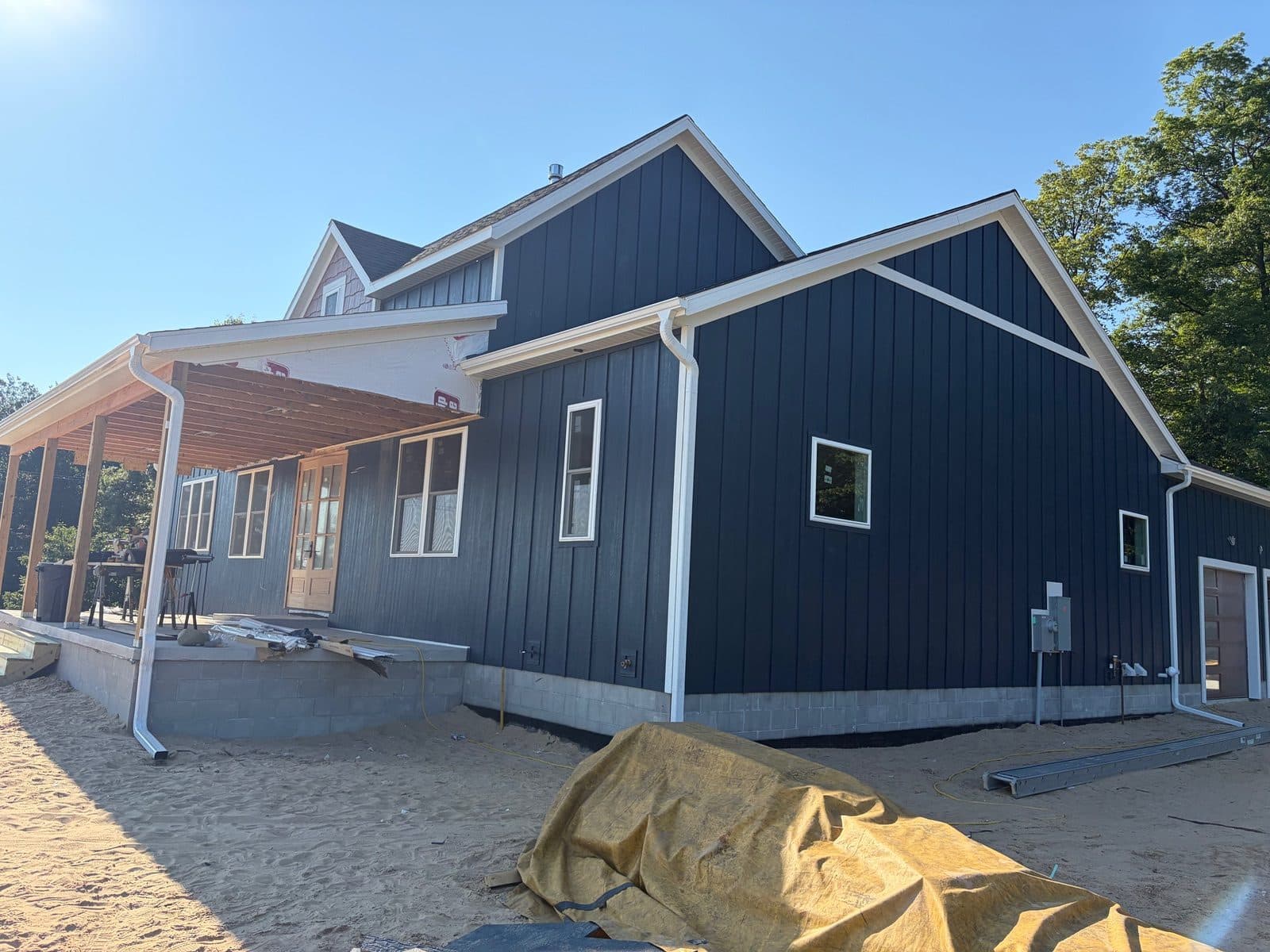 ~20 pcs of 16’x18” diamond kote midnight blue engineered board and batten siding