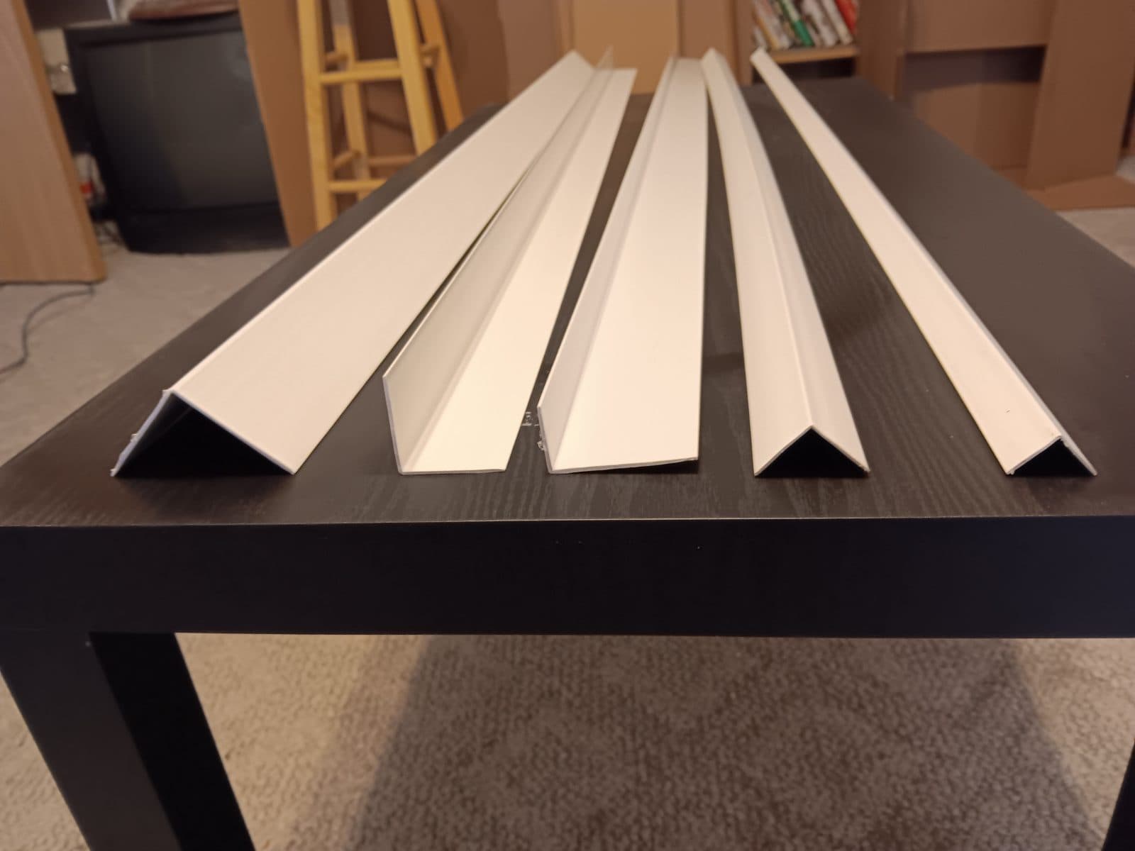 4000 linear feet of white vinyl 90 degree angle trim.